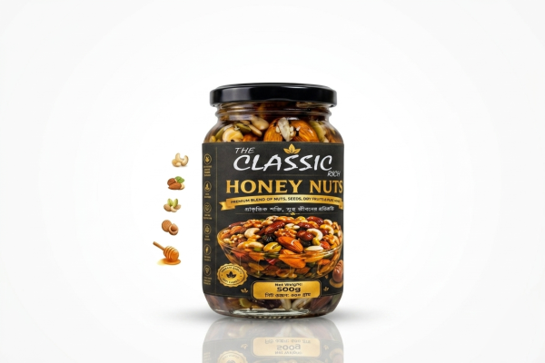 হানি নাটস বা honey nuts হলো কাজুবাদাম, কাঠবাদাম, আখরোট ও পেস্তা বাদামের সাথে খাঁটি মধুর এক অপূর্ব মেলবন্ধন, যা শরীরের শক্তির উৎস হিসেবে কাজ করে। অনেকেই জানতে চান হানি নাটস খেলে কি হয় বা হানি নাটস এর উপকারিতা কী; এটি মূলত রক্তে হিমোগ্লোবিন বাড়াতে, স্মৃতিশক্তি উন্নত করতে এবং দ্রুত শারীরিক ক্লান্তি দূর করতে সাহায্য করে। বাজারে honey nuts 500G price in Bangladesh কিংবা 1 kg Honey nuts price in Bangladesh খুঁজে দেখা যায় যে Ghorer bazar সহ বিভিন্ন পেজে এর ভিন্ন ভিন্ন দাম থাকে, তবে সেরা পুষ্টি পেতে সঠিক honey nuts recipe মেনে ঘরে তৈরি roasted honey nuts, spicy honey nuts বা baked honey coated nuts হতে পারে দারুণ সমাধান। এছাড়া honey roasted mixed nuts বা honey roasted cashew nuts নিয়মিত খেলে তা হৃদরোগের ঝুঁকি কমায় এবং দীর্ঘক্ষণ পেটে ক্ষুধা না রেখে ওজন নিয়ন্ত্রণে সহায়তা করে। সহজে প্রস্তুত করার পদ্ধতি বা how to make honey roasted nuts জানা থাকলে which nuts go well with honey? তা নির্বাচন করে ঘরেই মুখরোচক spicy roasted honey nuts বানিয়ে নেওয়া যায়, যা প্রতিদিনের পুষ্টি চাহিদা পূরণে অতুলনীয়। English Paragraph: Indulging in honey nuts is one of the most delicious ways to boost your daily nutrition, combining the natural sweetness of pure honey with energy-dense dry fruits. Many health-conscious individuals search for honey nuts benefits and compare options like Honey Nuts Ghorer bazar to check the honey nuts price before making a purchase. Whether you prefer crunchy honey roasted nuts, spicy honey nuts, or classic honey roasted mixed nuts, knowing how to make honey roasted nuts allows you to customize the flavors with different spices at home. From satisfying midday cravings with baked honey coated nuts to enjoying popular packaged snacks like honey nuts cheerios, incorporating honey roasted cashew nuts into your diet provides healthy fats, fiber, and antioxidant properties. Understanding honey nuts khele ki hoy highlights its role in boosting stamina, improving heart health, and maintaining focus throughout the day.